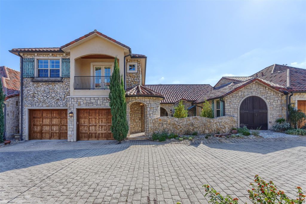 Stone exterior and tile roof of a home in Adriatica Villa District, McKinney