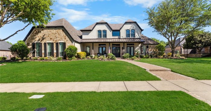 Gentle Creek home with stone exterior and landscaped lawn in Prosper, Texas