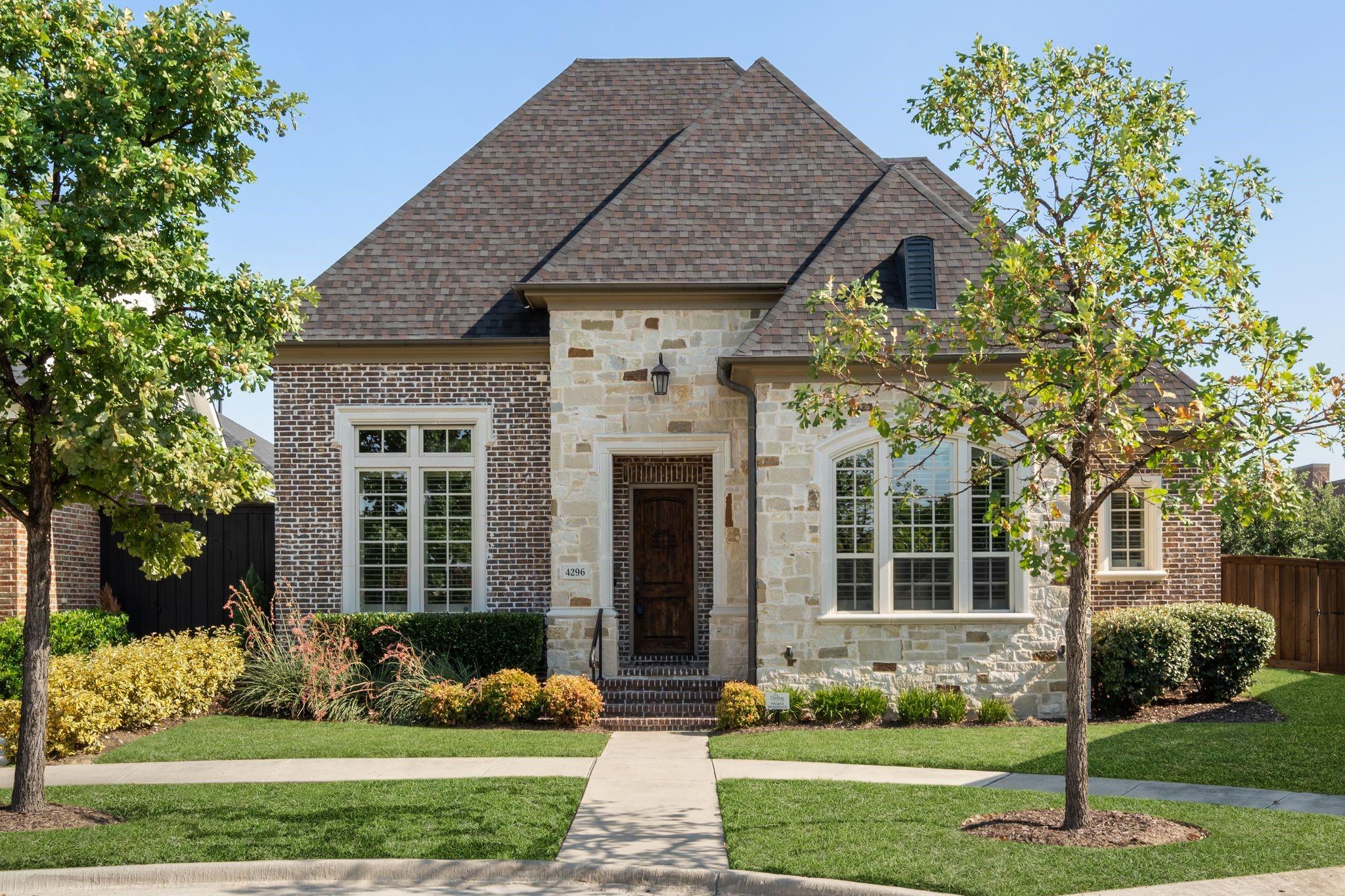 Brick and stone home in The Canals at Grand Park, Frisco