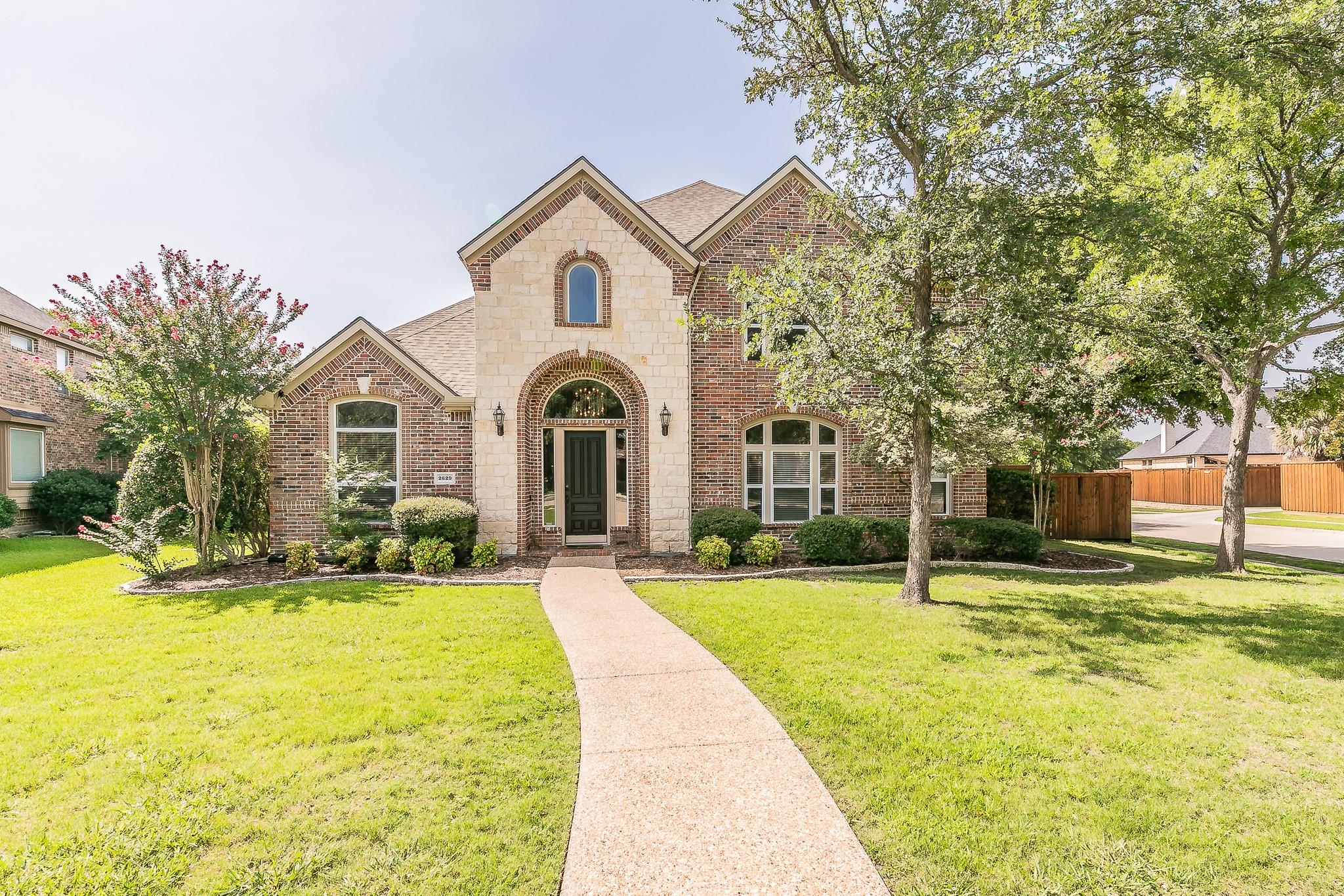 Brick and stone home in The Fairways, Frisco