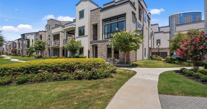 Contemporary townhomes and landscaped sidewalks at Icon at Legacy West in Plano, Texas